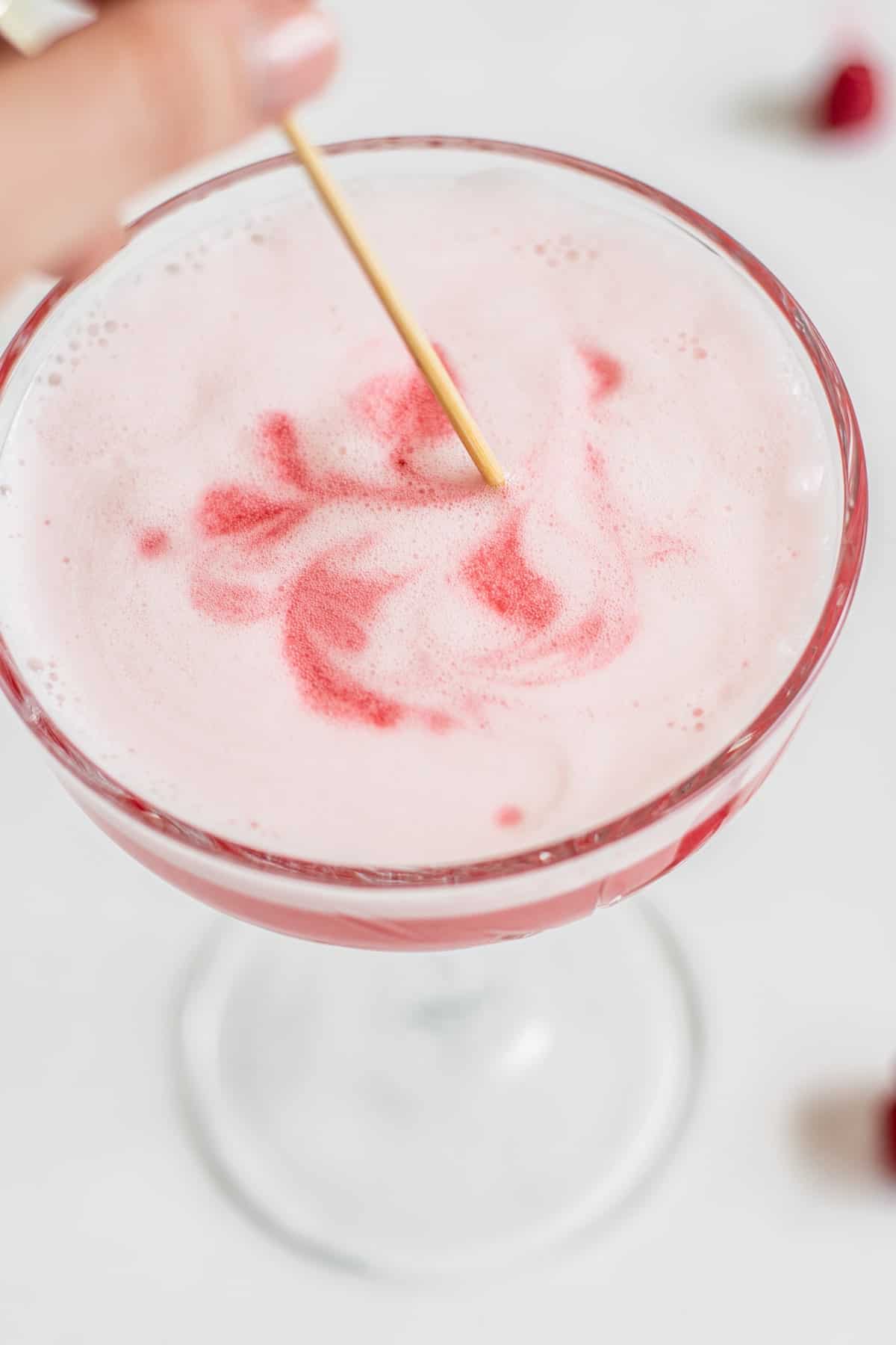 swirling foam on a cocktail.