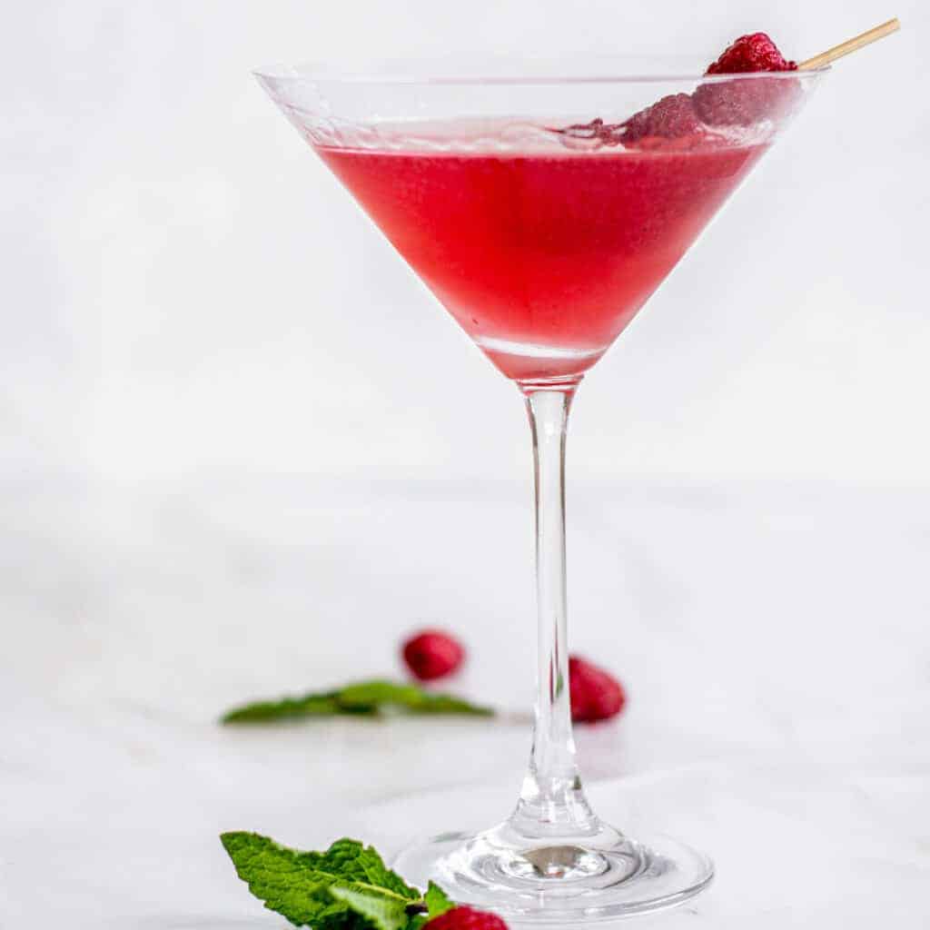 red martini with raspberries.