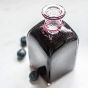 a jar of blueberry syrup.