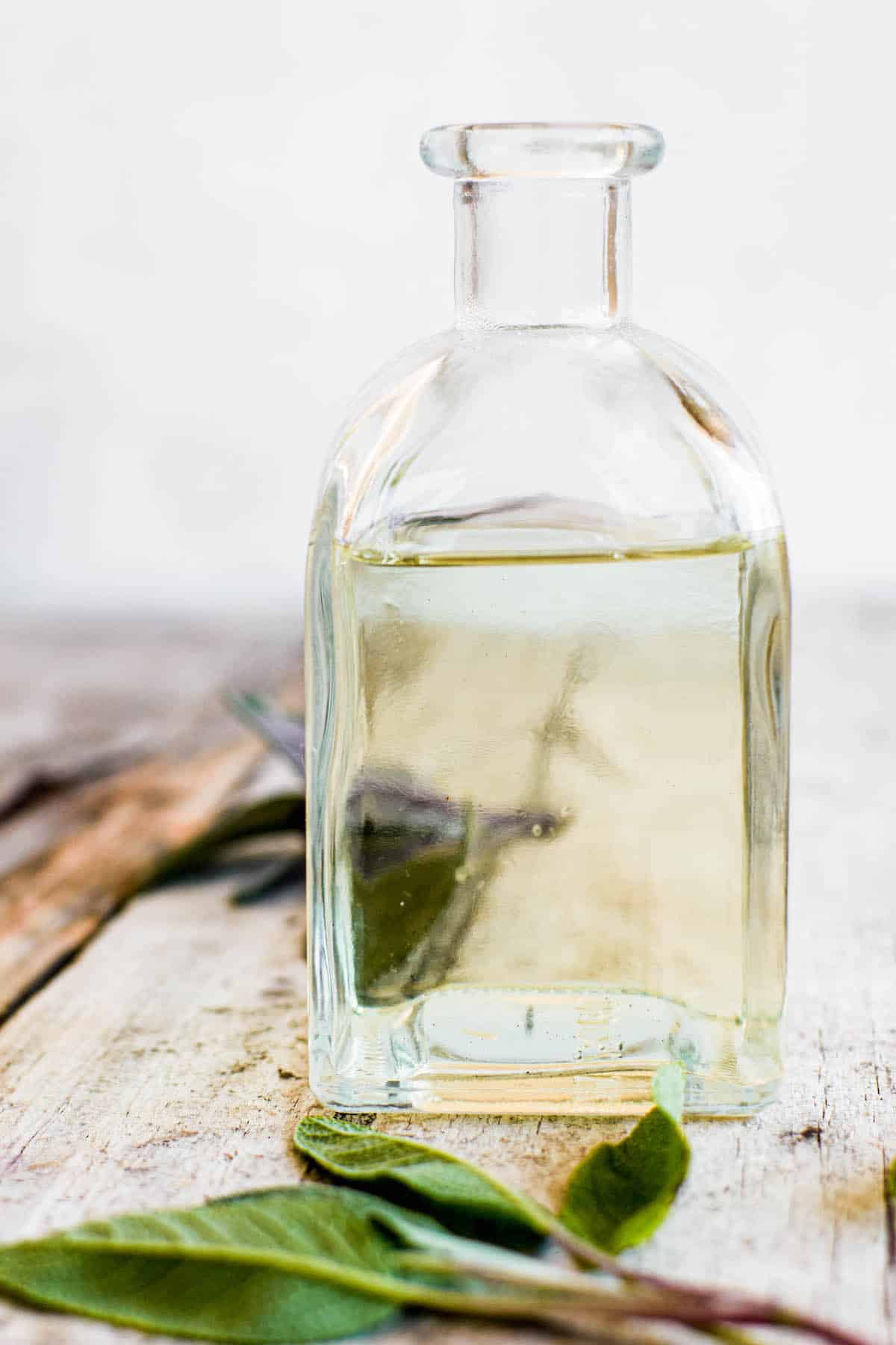 sage syrup in bottle.