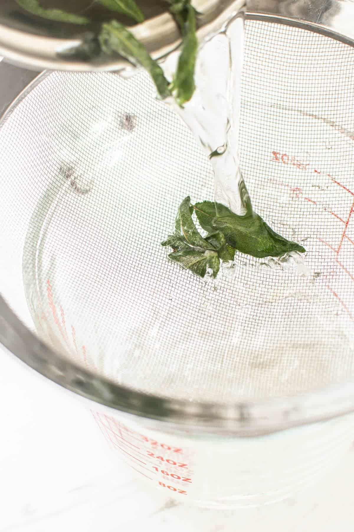 sage leaves in sieve.