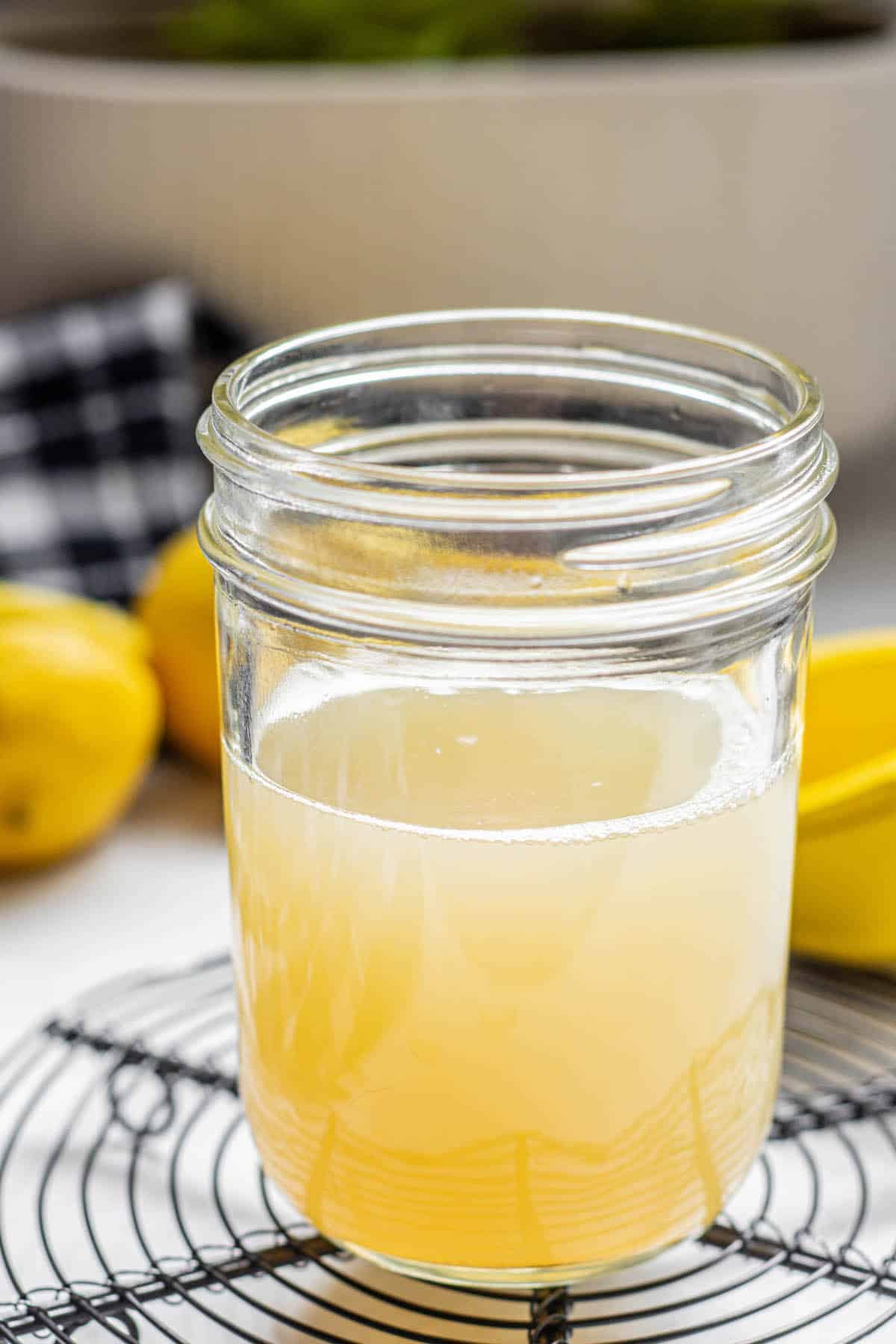 a jar of yellow sour mixture.