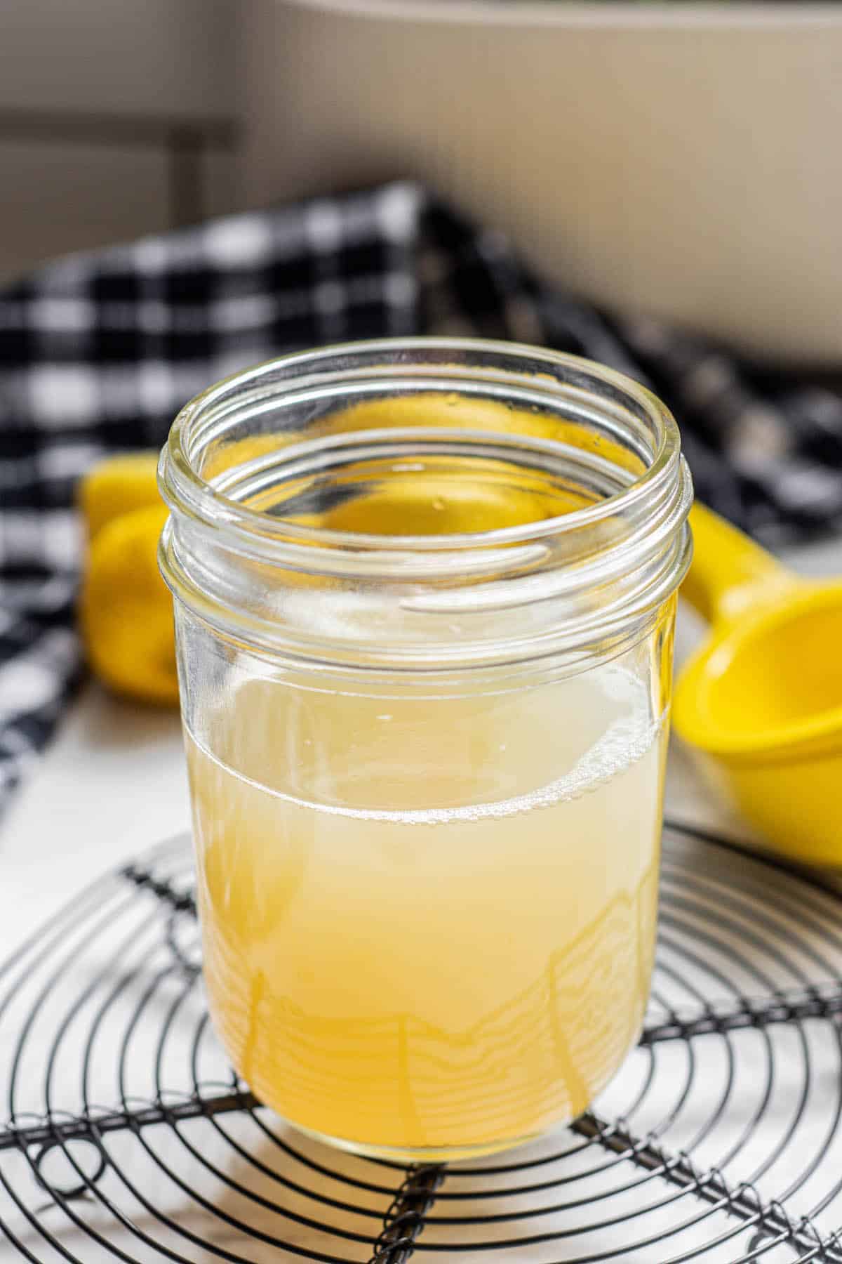a jar of yellow sour mixture.