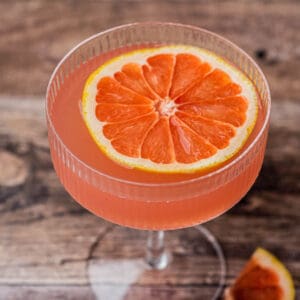 cropped pink cocktail with grapefruit slice.