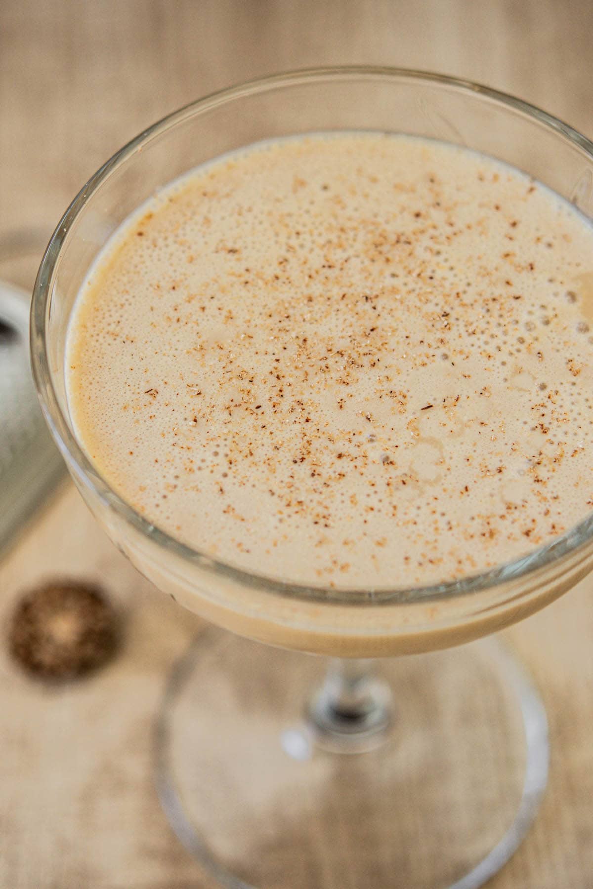 close up of cocktail with nutmeg on it.