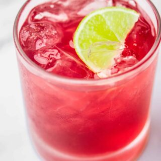 Close-up of Cape Codder (Vodka Cranberry) with a lime wedge.